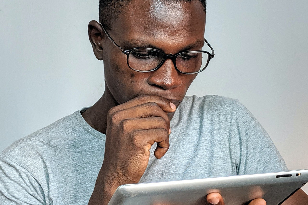 Image of man reading tips on how to preserve your vision