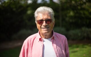 A man wears sunglasses to protect his eyes from UV rays