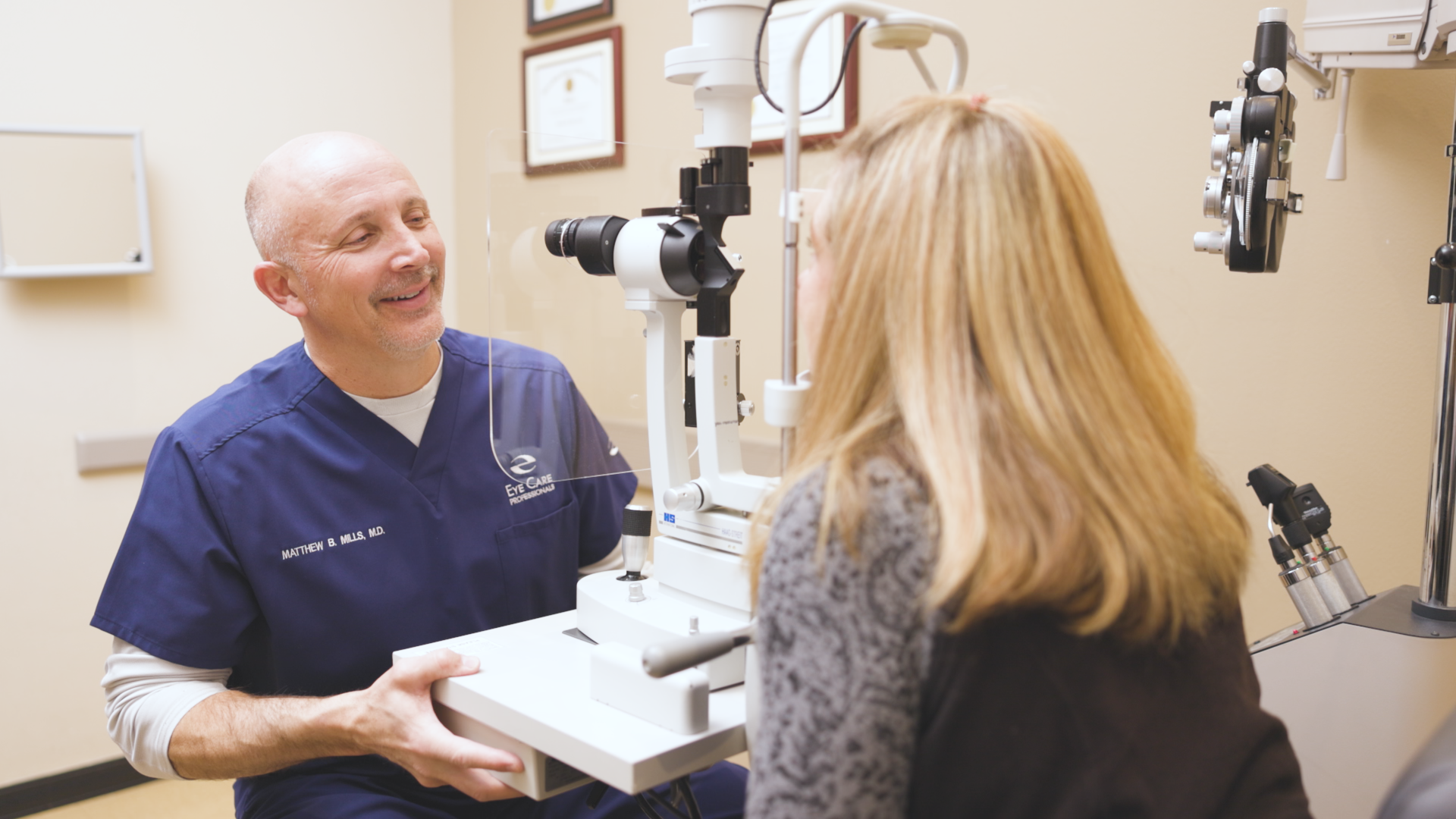 Dr. Matthew Mills, MD of Eye Care Professionals in Reno examines an eye patient