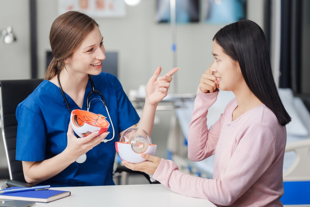 doctor speaking to her patient about eye treatment