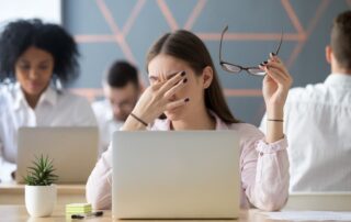 Women at work suffering from eye syndrome