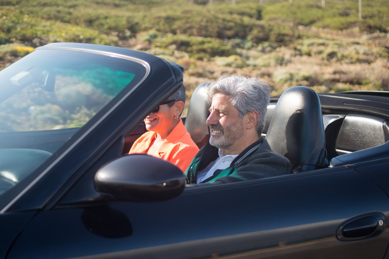 Mature man driving without glasses or contacts